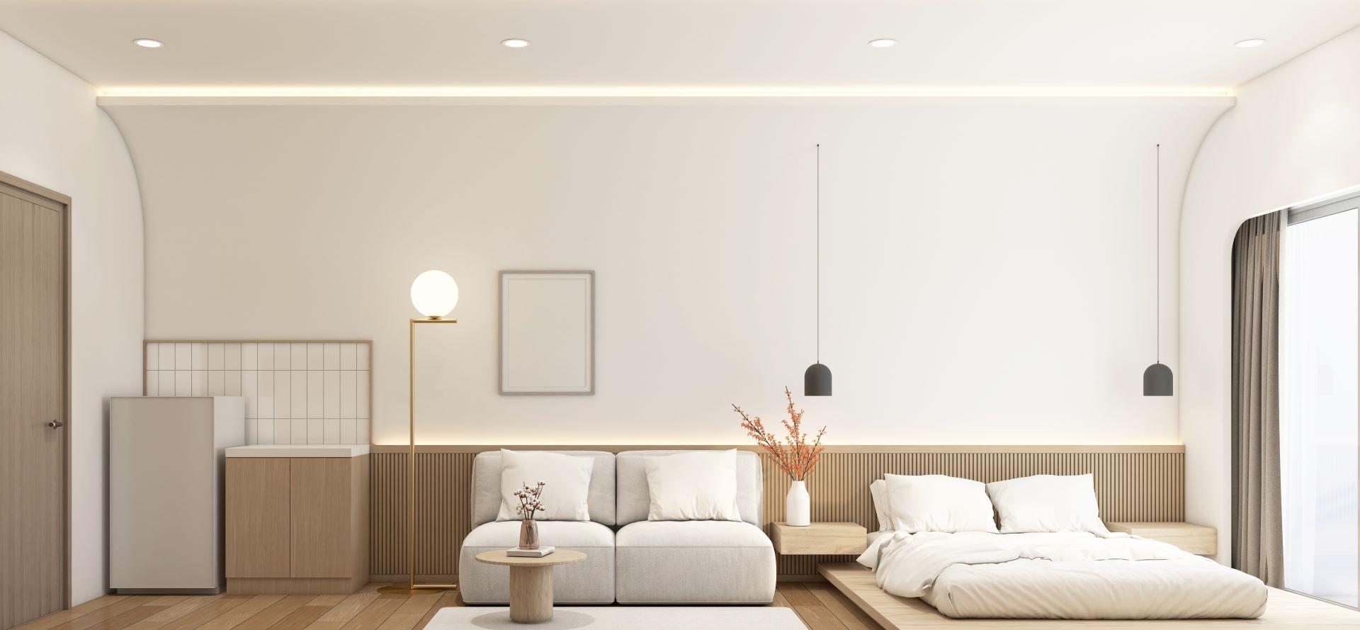 Modernes kleines Zimmer im japanischen Stil, dekoriert mit minimalistischem Sofa und weißem Bett, Vorratsschrank und Kühlschrank, Holzlattenwand und weißer gebogener Wand. 3d Rendering